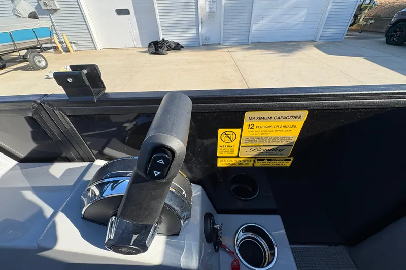 Slide: The Image of Control panel of 2026 Bentley Pontoons Fish 220 FWD CW with capacity warning label. - 22