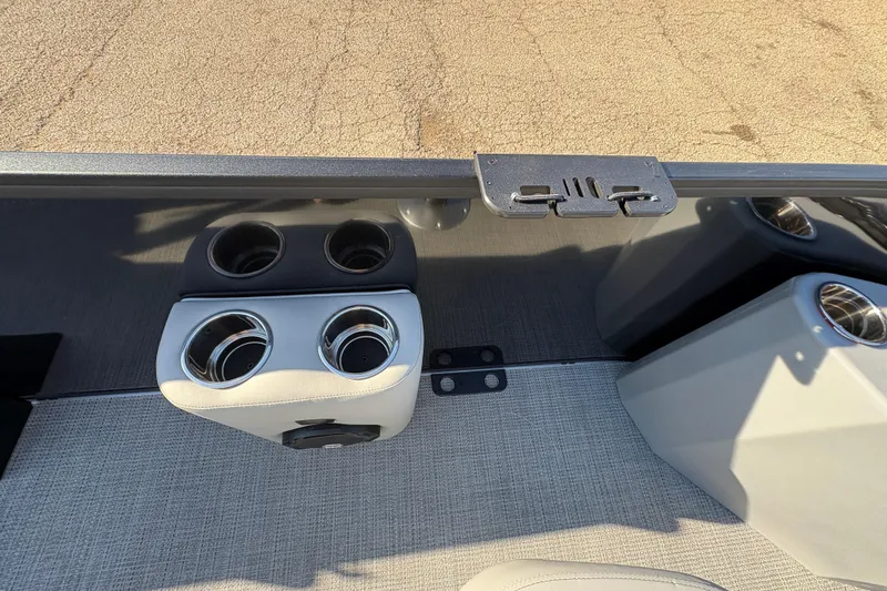 Slide: The Image of 2026 Bentley Pontoons Fish 220 FWD CW interior with cup holders and sleek design. - 25