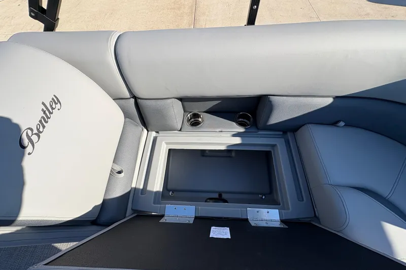 Slide: The Image of 2026 Bentley Pontoons Fish 220 FWD CW interior seating with storage compartment. - 27
