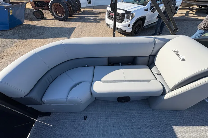 Slide: The Image of 2026 Bentley Pontoons Fish 220 FWD CW with luxurious seating and elegant design. - 29