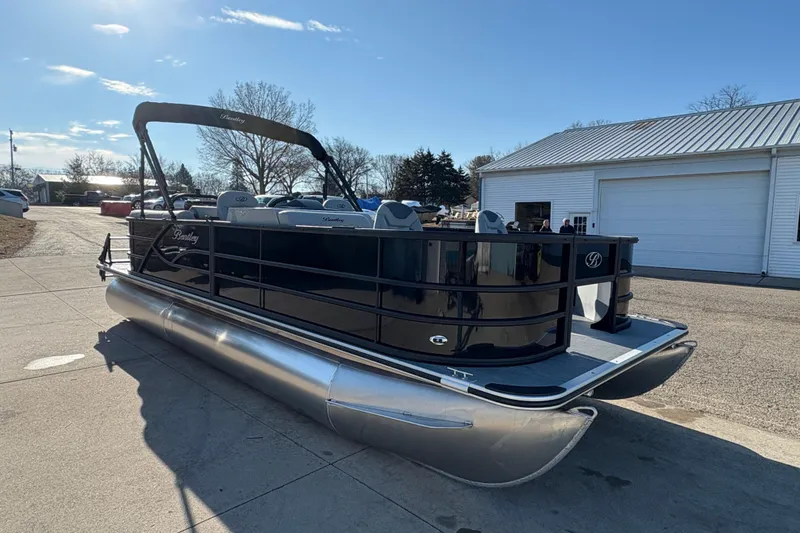 Slide: The Image of 2026 Bentley Pontoons Fish 220 FWD CW, sleek black design, parked outdoors. - 3