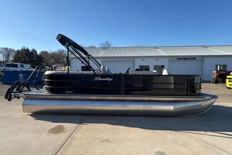 Slide: The Image of 2026 Bentley Pontoons Fish 220 FWD CW pontoon boat parked outside showroom. - 4