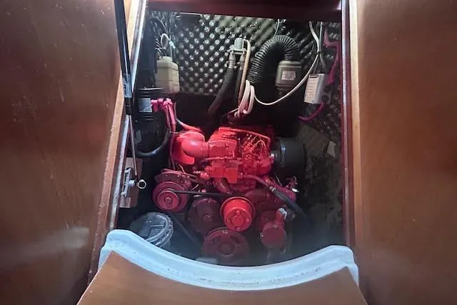 Slide: The Image of Engine compartment of 2001 Beneteau Oceanis 461 sailboat, showcasing mechanical components. - 11