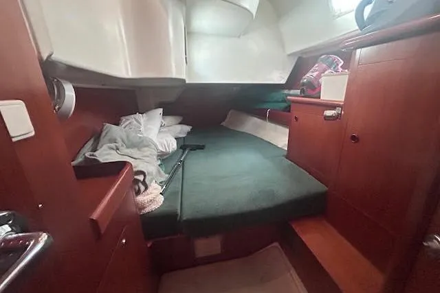 Slide: The Image of Cozy cabin interior of 2001 Beneteau Oceanis 461 sailboat with wooden furnishings. - 21
