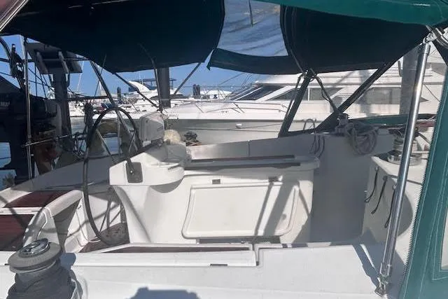 Slide: The Image of 2001 Beneteau Oceanis 461 sailboat cockpit with canopy, docked at marina. - 3