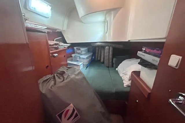 Slide: The Image of Interior cabin of 2001 Beneteau Oceanis 461 yacht with storage and bedding. - 30