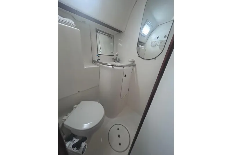 Slide: The Image of Bathroom interior of 2001 Beneteau Oceanis 461 yacht, featuring toilet and sink. - 7