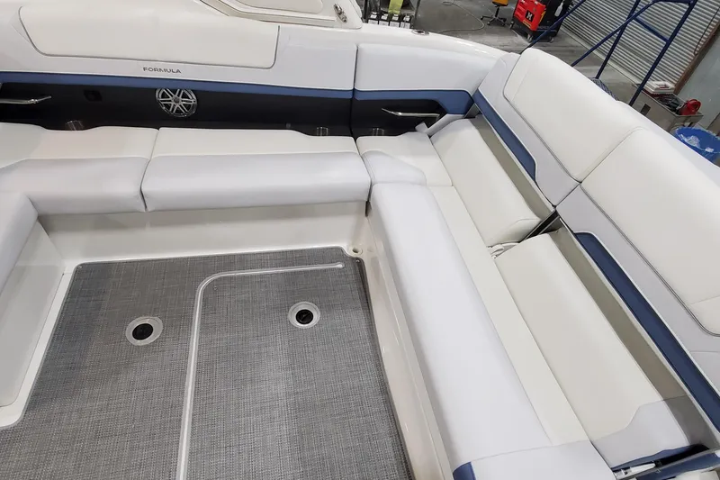 Slide: The Image of 2020 Formula 310 Bowrider interior with white seating and gray flooring. - 11