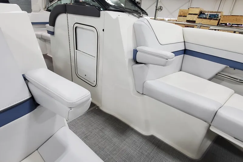 Slide: The Image of 2020 Formula 310 Bowrider interior with white seating and blue accents. - 29