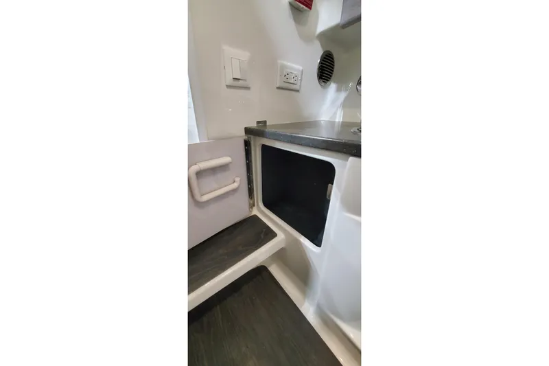 Slide: The Image of Interior storage compartment of 2020 Formula 310 Bowrider boat. - 35