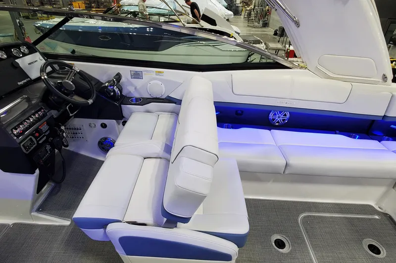 Slide: The Image of 2020 Formula 310 Bowrider interior with white seating and modern dashboard. - 38