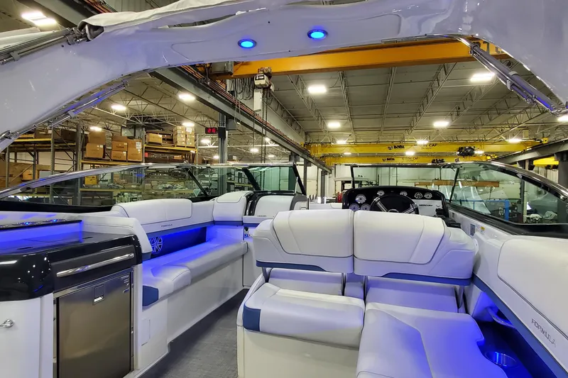 Slide: The Image of 2020 Formula 310 Bowrider interior with luxurious seating and ambient blue lighting. - 39