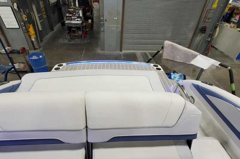 Slide: The Image of 2020 Formula 310 Bowrider interior with white seating in a workshop setting. - 41