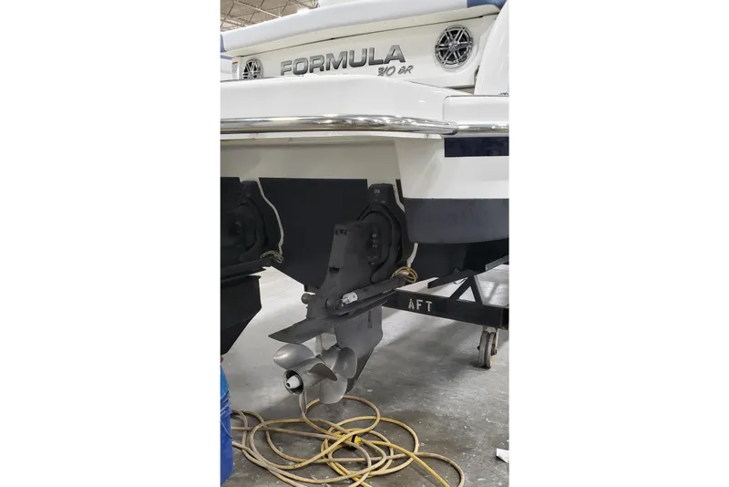 Slide: The Image of Rear view of a 2020 Formula 310 Bowrider boat on a trailer. - 5