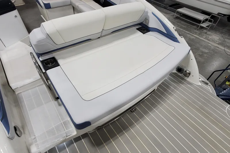 Slide: The Image of 2020 Formula 310 Bowrider boat interior with white seating and cup holders. - 6
