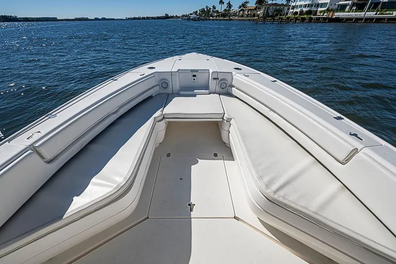 Slide: The Image of 2005 Intrepid 300 Center Console boat with spacious seating on calm waters. - 22