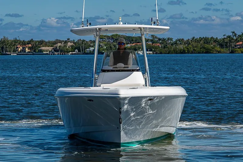 Slide: The Image of 2005 Intrepid 300 Center Console boat cruising on a sunny day. - 4