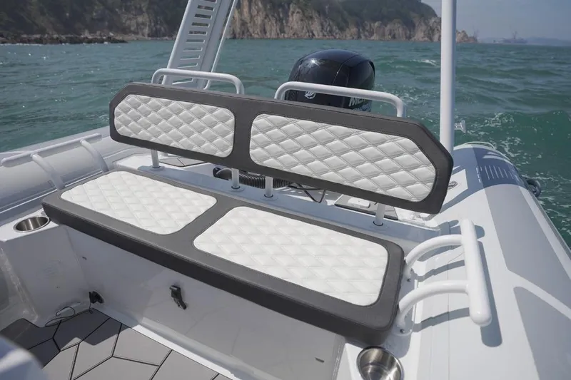Slide: The Image of 2026 Highfield Sport 660 boat with quilted seating, on open water. - 4