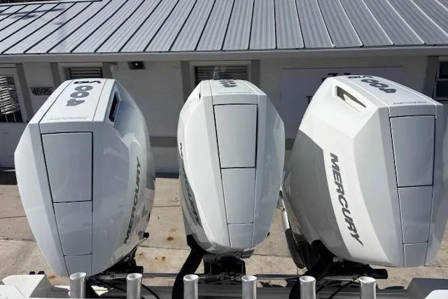 Slide: The Image of Triple Mercury outboard engines on a 2008 Everglades 350LX boat. - 12