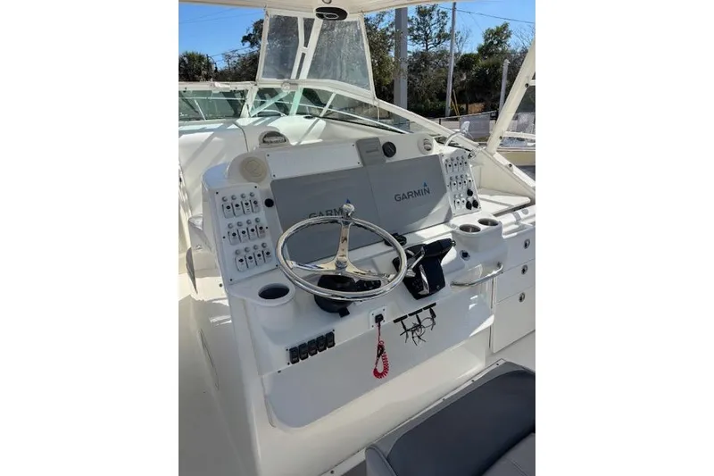 Slide: The Image of 2008 Everglades 350LX boat helm with Garmin navigation system and steering wheel. - 18