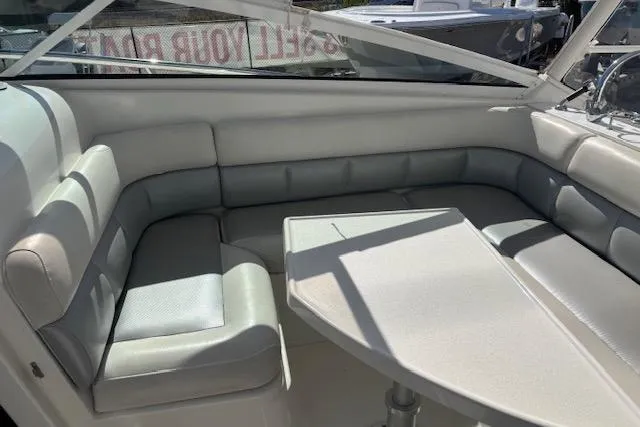 Slide: The Image of Interior seating area of a 2008 Everglades 350LX boat with a table. - 23
