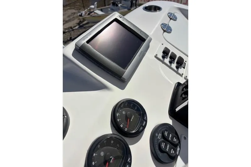 Slide: The Image of Dashboard of 2008 Everglades 350LX boat with gauges and controls. - 26