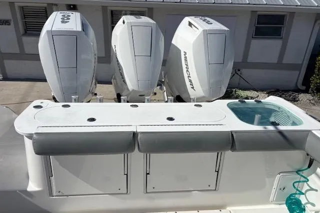 Slide: The Image of 2008 Everglades 350LX boat with triple Mercury outboard engines and fishing station. - 9
