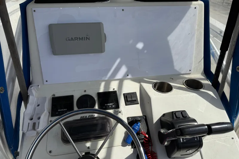 Slide: The Image of 2007 Sea Pro 270 Center Console dashboard with Garmin navigation system and controls. - 11