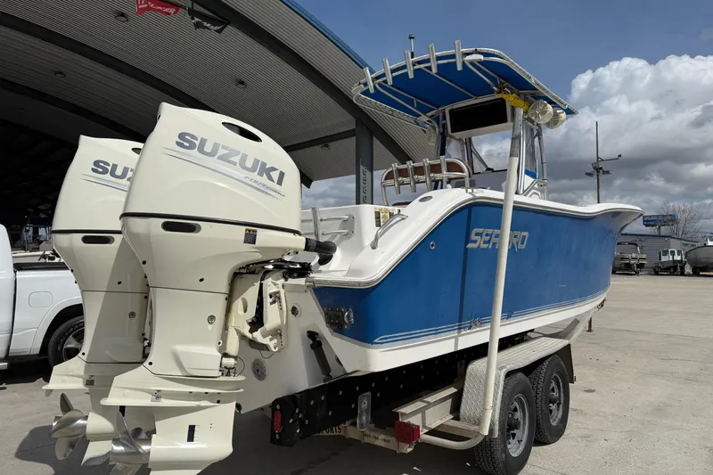 Slide: The Image of 2007 Sea Pro 270 Center Console boat with Suzuki outboard motors on a trailer. - 4