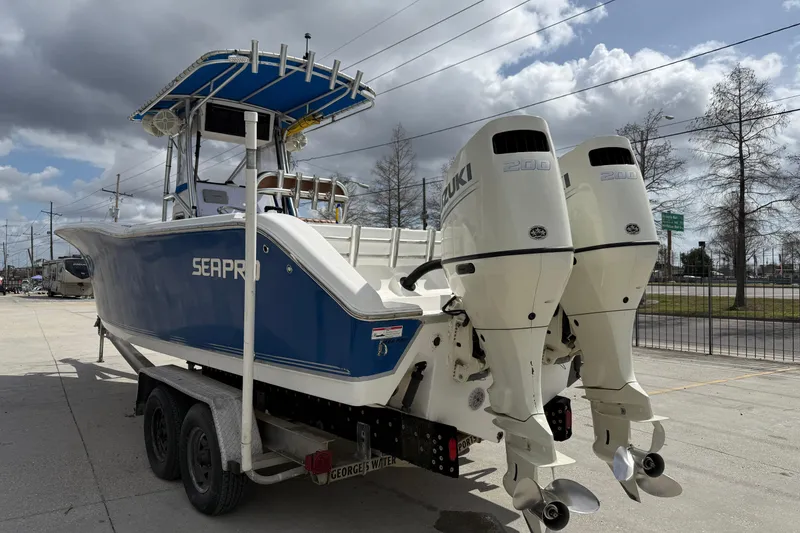 Slide: The Image of 2007 Sea Pro 270 Center Console boat with dual Suzuki engines on a trailer. - 5