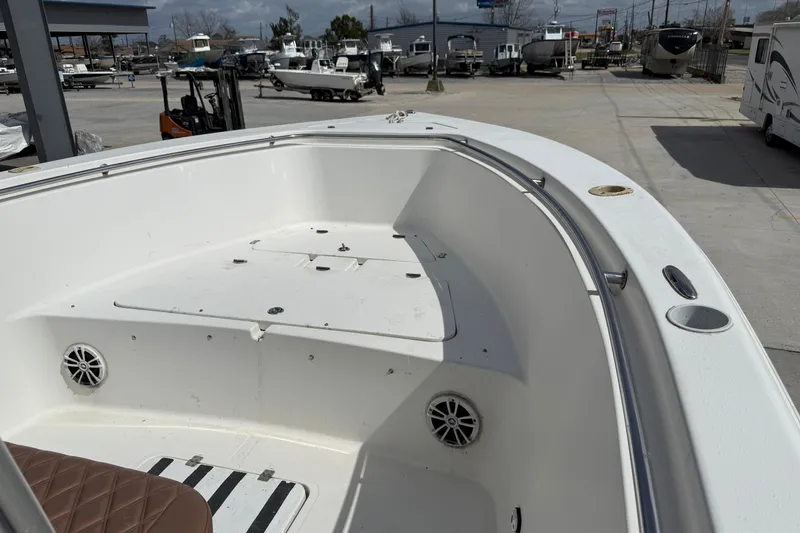 Slide: The Image of 2007 Sea Pro 270 Center Console boat interior with seating and speakers. - 8