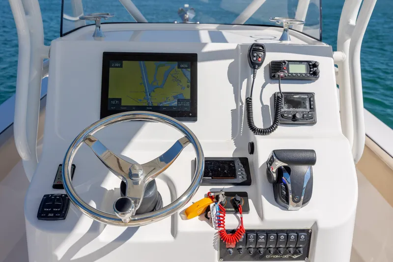 Slide: The Image of Century Coronado 2022 boat dashboard with navigation and communication equipment. - 14