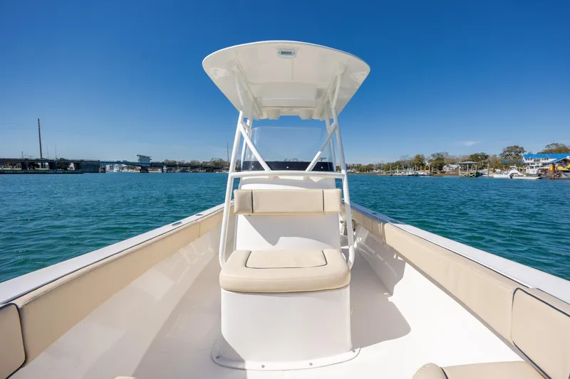 Slide: The Image of 2022 Century Coronado boat on calm water under clear blue sky. - 18