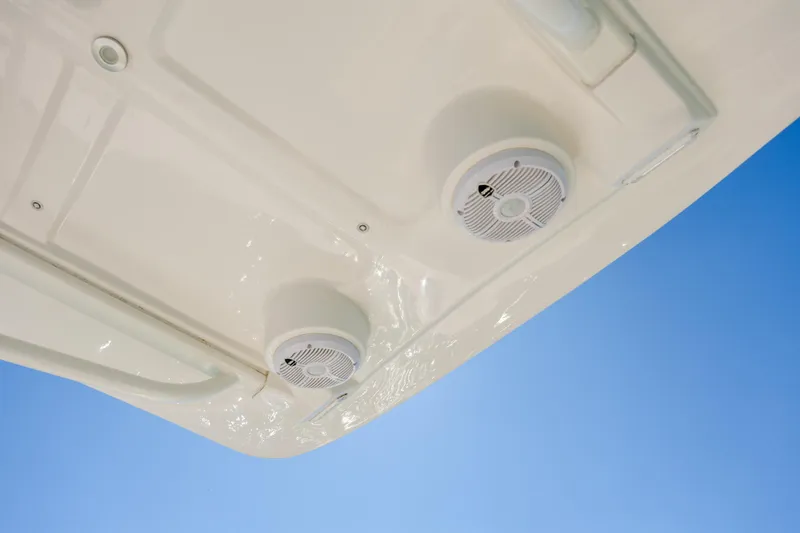 Slide: The Image of 2022 Century Coronado boat speakers against clear blue sky. - 21