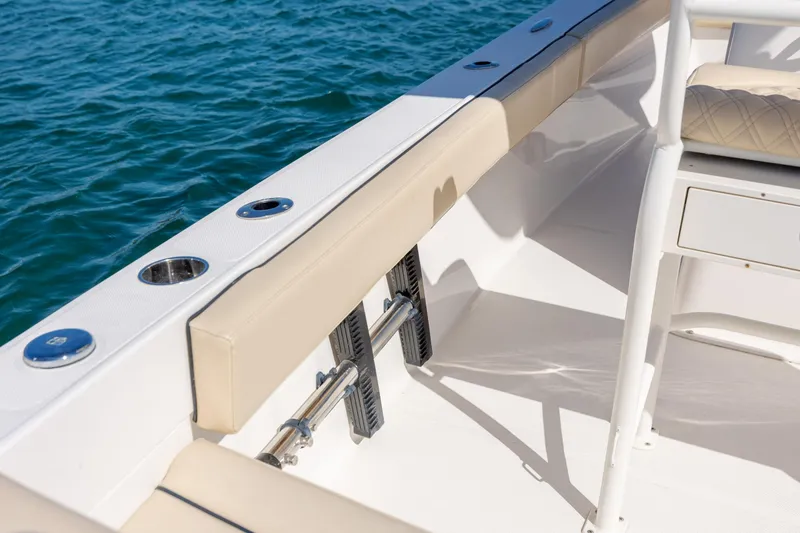 Slide: The Image of 2022 Century Coronado boat interior with beige seating and ocean backdrop. - 25