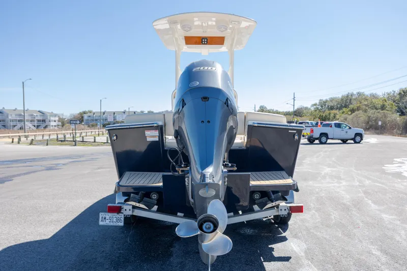Slide: The Image of 2022 Century Coronado boat on trailer with powerful outboard motor. - 28