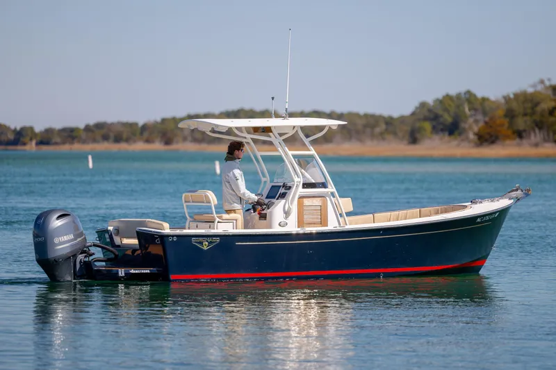 Slide: The Image of 2022 Century Coronado boat on calm water with Yamaha outboard motor. - 4