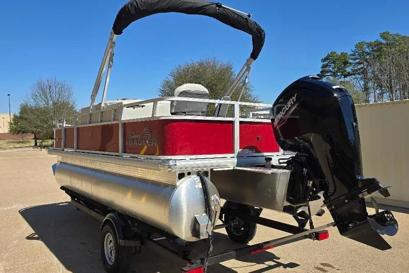 Slide: The Image of 2026 Sun Tracker Bass Buggy 18 DLX pontoon boat with Mercury outboard motor. - 2