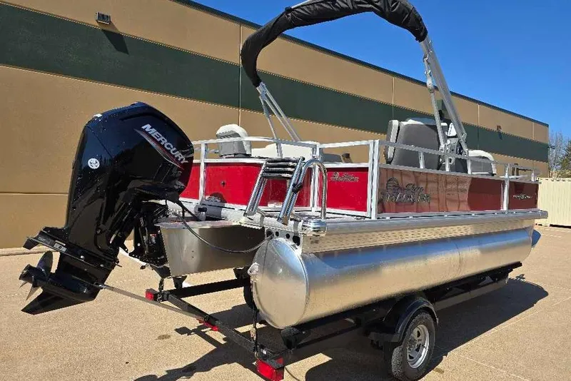 Slide: The Image of 2026 Sun Tracker Bass Buggy 18 DLX pontoon boat with Mercury outboard motor. - 4