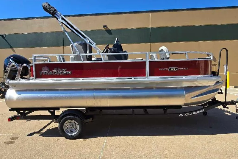 Slide: The Image of 2026 Sun Tracker Bass Buggy 18 DLX pontoon boat on trailer, side view. - 5