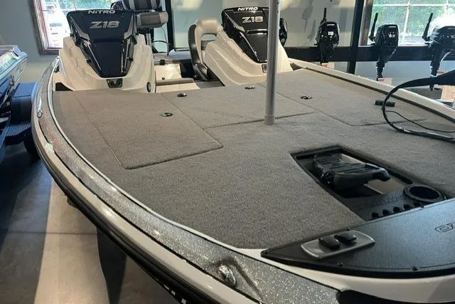 Slide: The Image of 2025 Nitro Z18 boat with spacious deck and dual seating in showroom. - 4