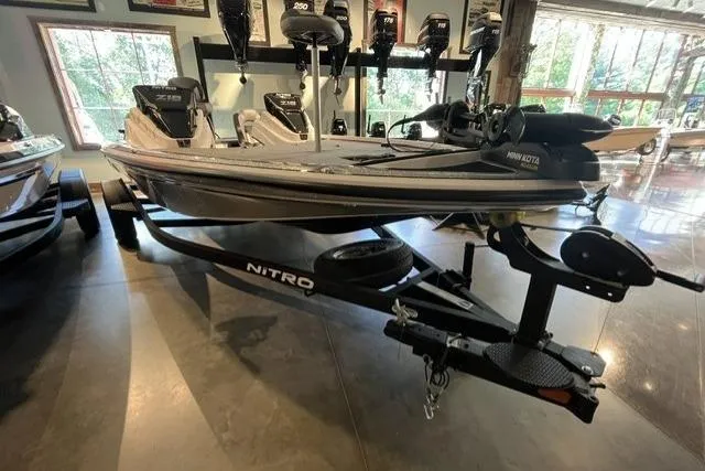 Slide: The Image of 2025 Nitro Z18 boat on trailer in showroom, featuring sleek design and advanced equipment. - 2