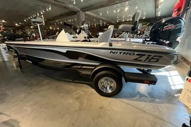 The Image of 2025 Nitro Z18 boat in showroom, sleek design, metallic finish, equipped with powerful engine. - 0