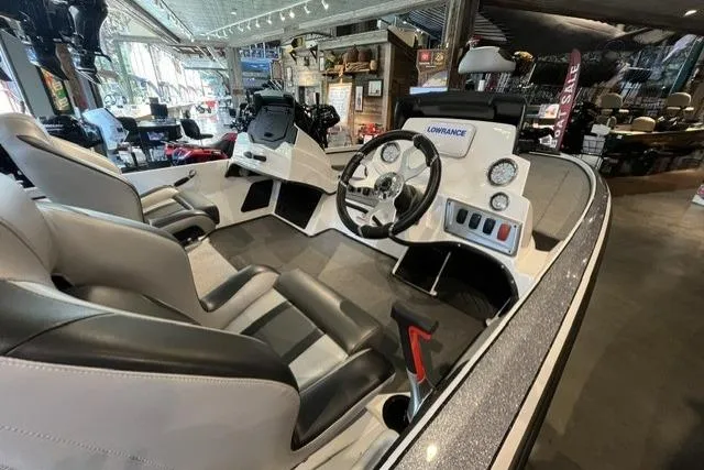 Slide: The Image of Interior of a 2025 Nitro Z18 boat featuring modern controls and seating. - 5