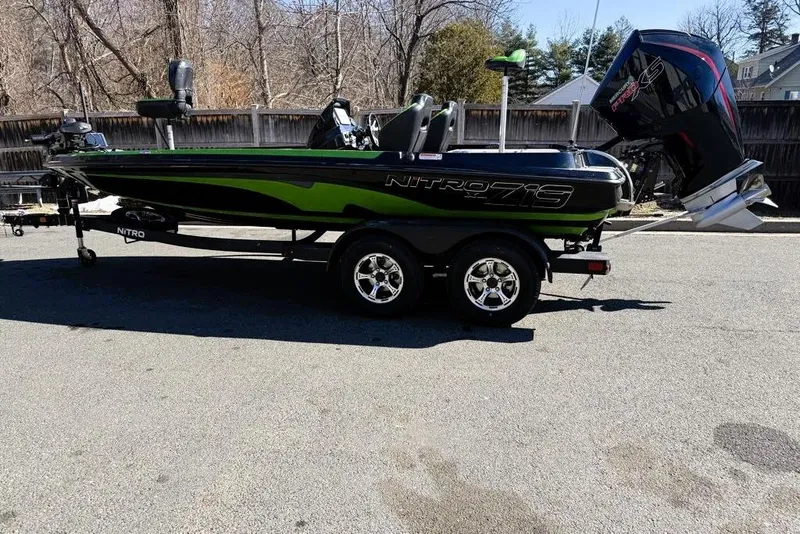 The Image of 2026 Nitro Z19 XL Pro boat with trailer, parked outdoors on a sunny day. - 0
