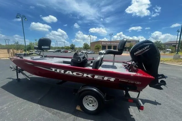 The Image of 2026 Tracker Pro 170 boat with Mercury engine, parked outdoors under a blue sky. - 0