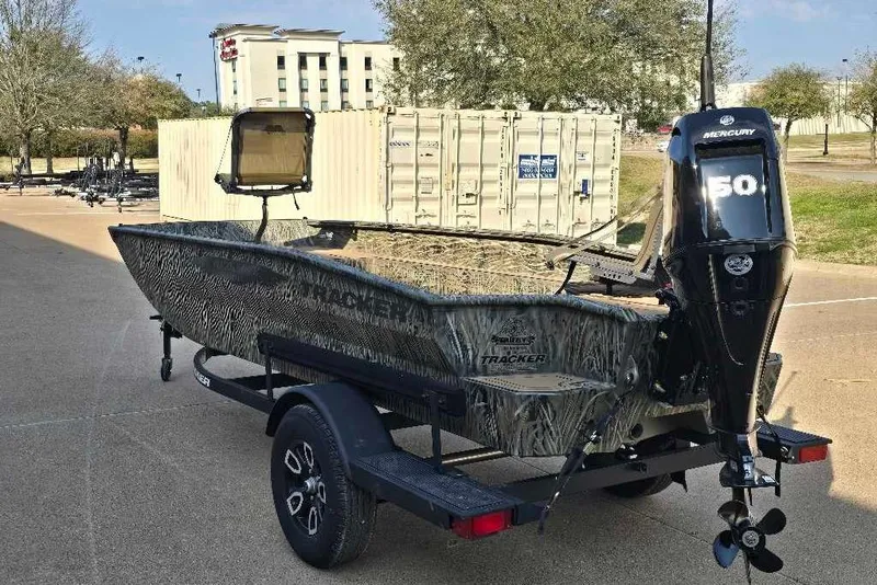 Slide: The Image of 2026 Tracker Grizzly 1650 T Prairie Wings Edition boat with Mercury 50 engine on trailer. - 10