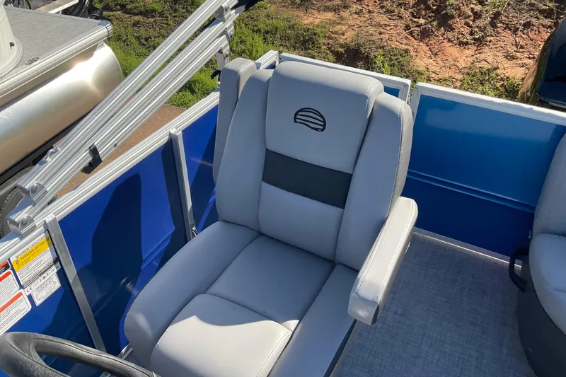 Slide: The Image of 2026 Sun Tracker Party Barge 16 DLX with comfortable seating and blue paneling. - 68