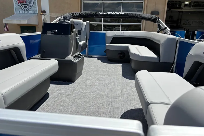 Slide: The Image of 2026 Sun Tracker Party Barge 16 DLX interior with gray seating and modern design. - 69