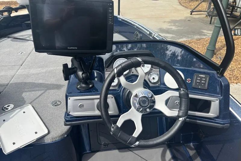 Slide: The Image of Steering console of 2026 Nitro ZV21 Pro boat with Garmin display and controls. - 13